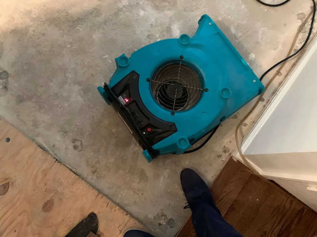 Air mover drying subfloor during Leak Detection & Repair in Santaquin